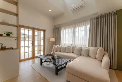 Spacious modern living room with natural light and elegant decor