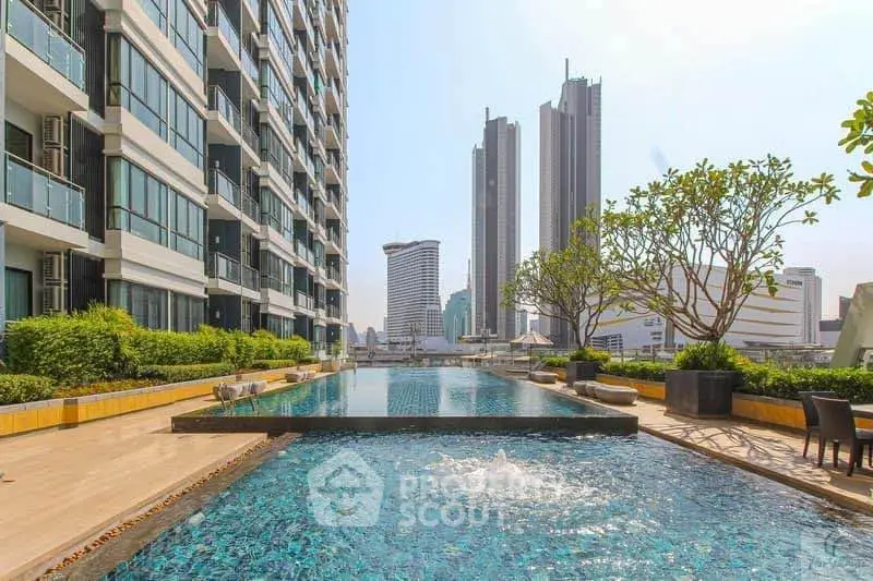 Luxurious high-rise building with stunning rooftop pool and city skyline view.