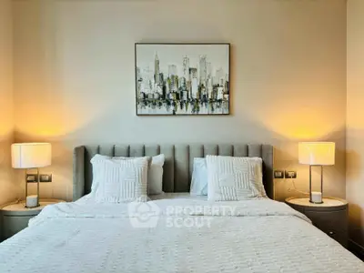Elegant bedroom with modern decor and ambient lighting, featuring a stylish cityscape painting above the bed.