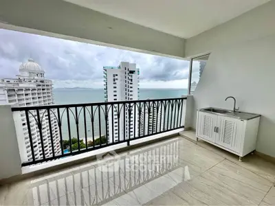 Spacious balcony with ocean view and modern sink, perfect for relaxation.