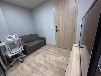 Modern compact living room with sleek furniture and wooden flooring
