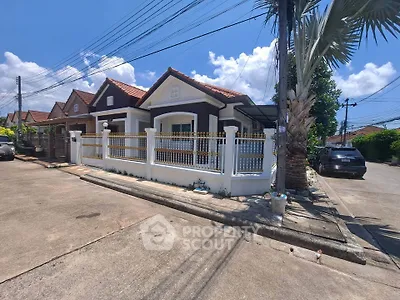 Charming suburban house with fenced yard and driveway on sunny day