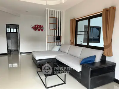 Spacious modern living room with stylish sectional sofa and elegant decor