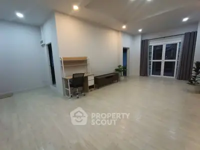 Spacious modern living room with sleek flooring and stylish furniture