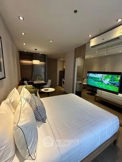 Modern bedroom with stylish decor and in-room amenities