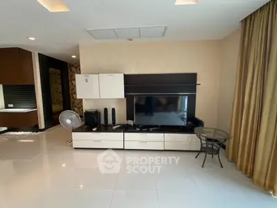 Spacious modern living room with sleek entertainment center and elegant decor