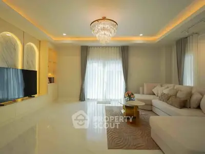 Luxurious living room with elegant chandelier and spacious seating area