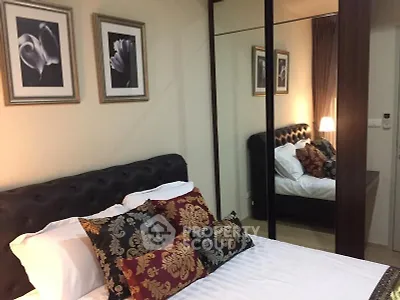 Elegant bedroom with mirrored wardrobe and stylish decor