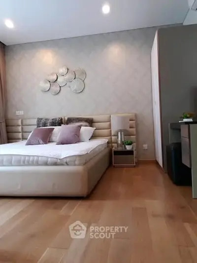 Luxurious bedroom with elegant decor and plush bedding in modern apartment