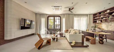 Luxurious modern living room with elegant furniture and stylish decor, featuring a large TV and open layout.