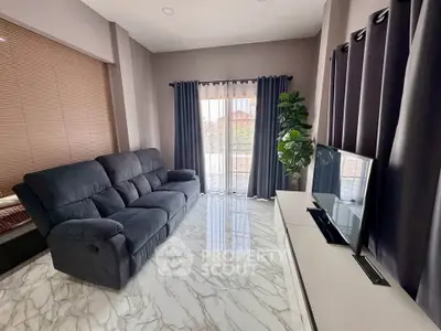 Modern living room with sleek marble flooring and plush sofa, featuring a large window with elegant curtains.