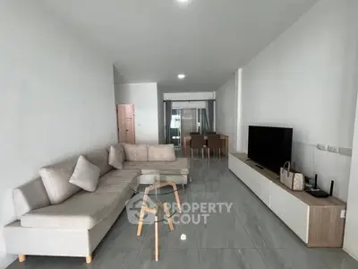 Spacious modern living room with sleek furniture and open layout