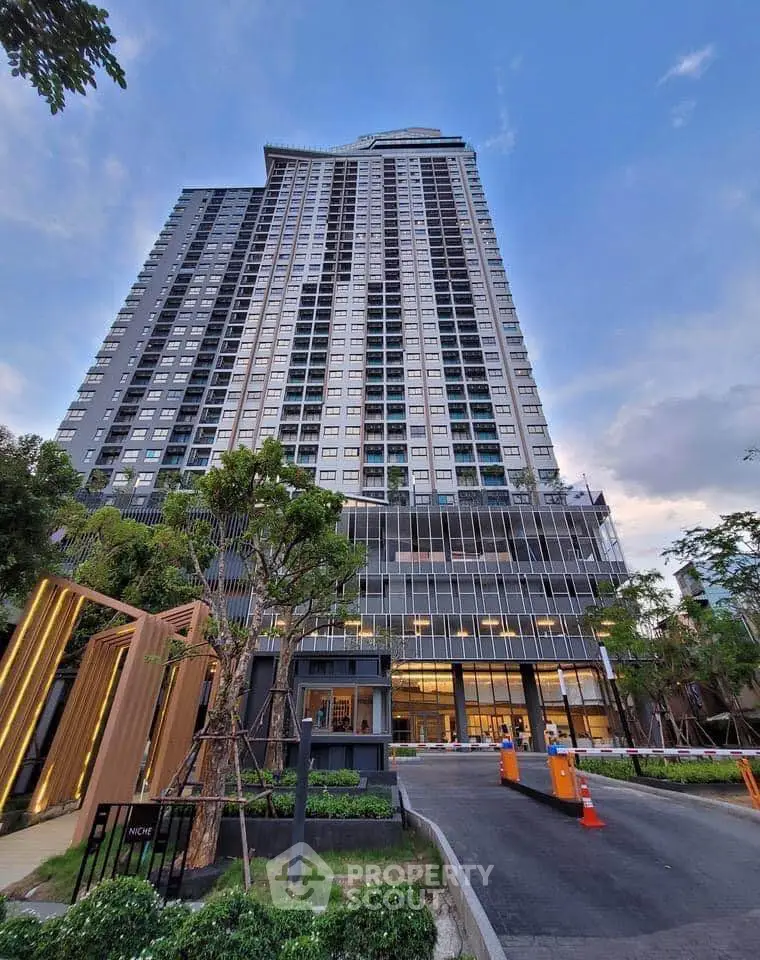 Stunning high-rise building with modern architecture and lush landscaping