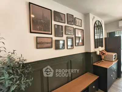Charming interior with stylish wall art and modern furniture in a cozy living space.