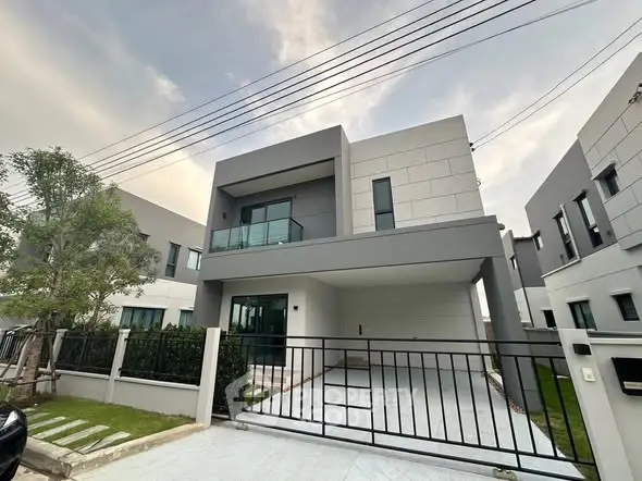Modern two-story house with sleek design and spacious driveway