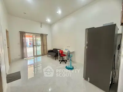 Spacious living room with modern furniture and large windows for natural light