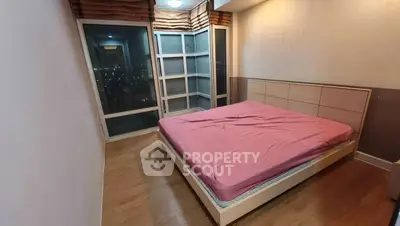 Spacious bedroom with city view and modern furnishings