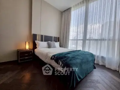 Modern bedroom with large window and stylish decor