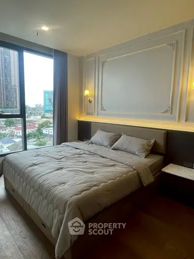 Luxurious bedroom with city view in modern high-rise apartment