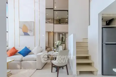 Modern duplex living room with stylish decor and cozy seating area