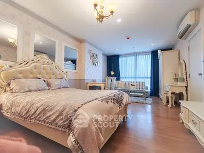 Luxurious bedroom with elegant decor and ample natural light