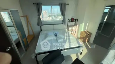 Bright bedroom with large window and modern furnishings