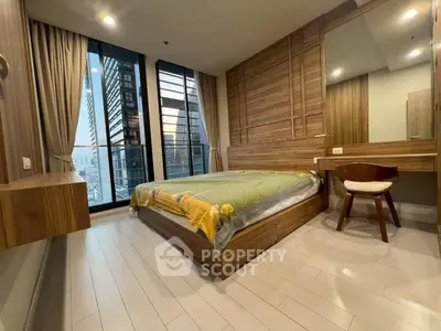 Modern bedroom with wooden accents and city view, featuring a cozy bed and stylish furniture.