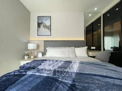 Modern bedroom with stylish decor and ample natural light