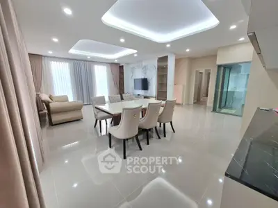 Spacious modern living room with elegant dining area and stylish lighting
