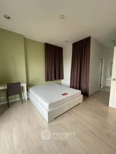 Spacious bedroom with minimalist design and natural light