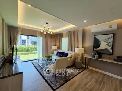 Elegant living room with modern decor and large window overlooking garden