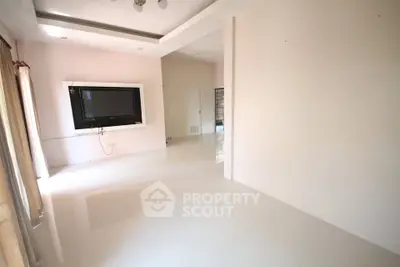Spacious modern living room with large windows and sleek design