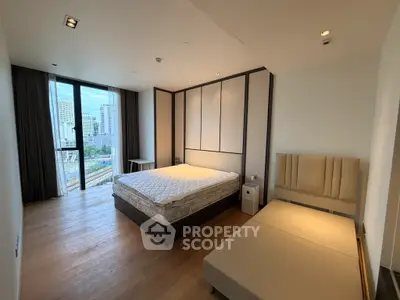 Spacious modern bedroom with city view and elegant furnishings