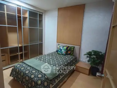 Cozy bedroom with built-in wardrobe and stylish decor