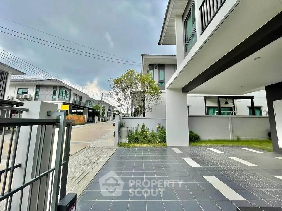 Modern residential property with spacious driveway and contemporary architecture.
