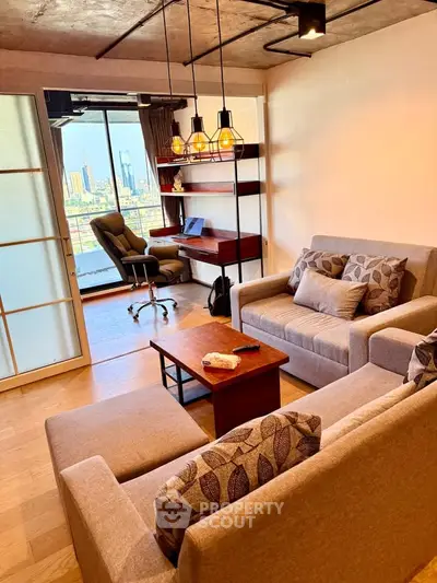 Modern living room with city view, stylish lighting, and cozy seating area.