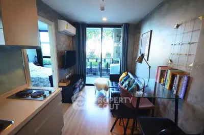 Modern living room with open kitchen and balcony view in stylish apartment