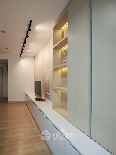Modern living room with sleek built-in shelving and minimalist design