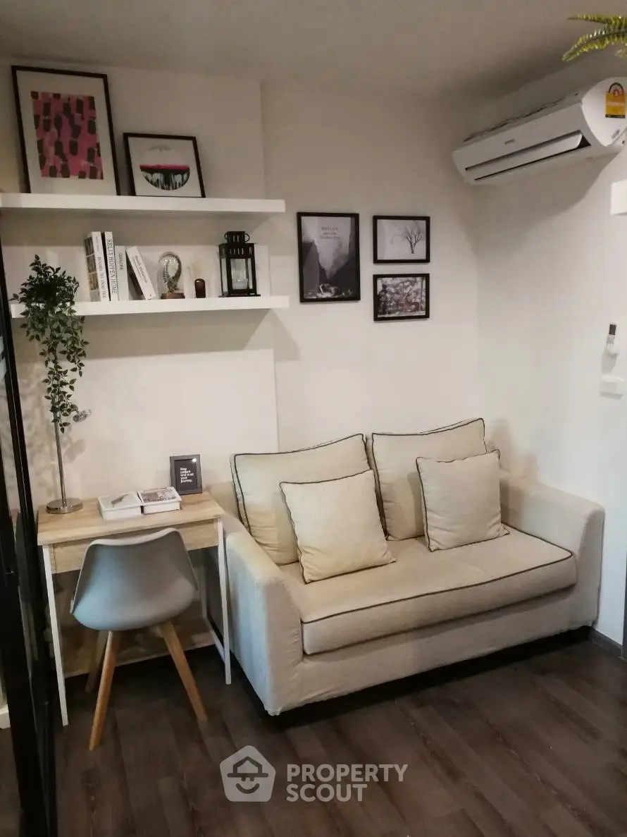 Cozy living room with modern decor and compact workspace