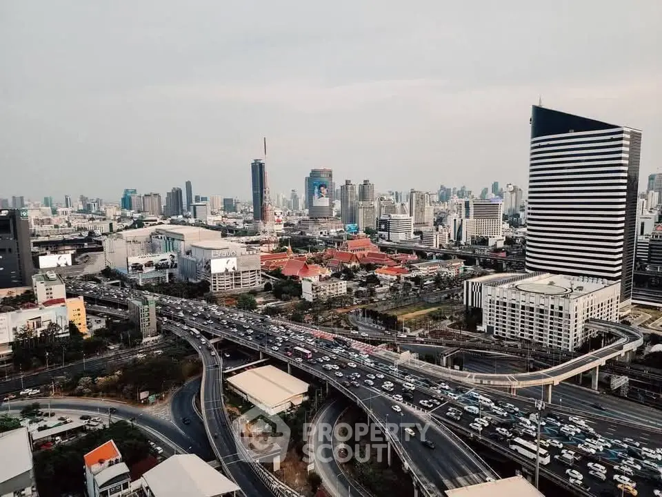 Stunning cityscape view showcasing modern skyscrapers and bustling highways, perfect for urban living enthusiasts.