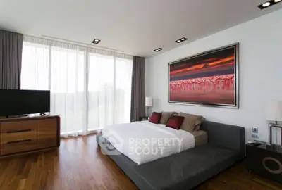 Luxurious modern bedroom with large window and elegant decor