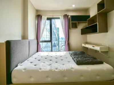 Modern bedroom with city view and stylish shelving in a high-rise apartment.