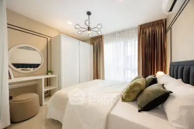 Luxurious bedroom with elegant decor, plush bedding, and modern lighting in a stylish apartment.