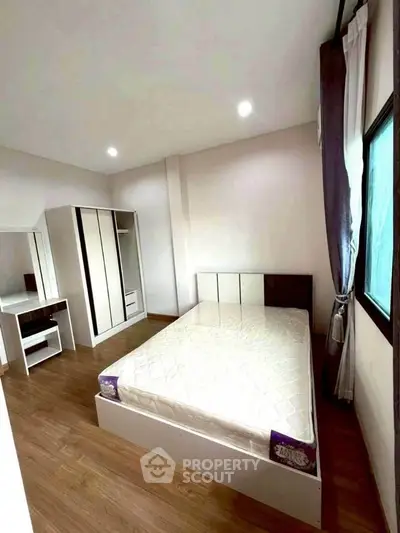 Modern bedroom with stylish furniture and natural light