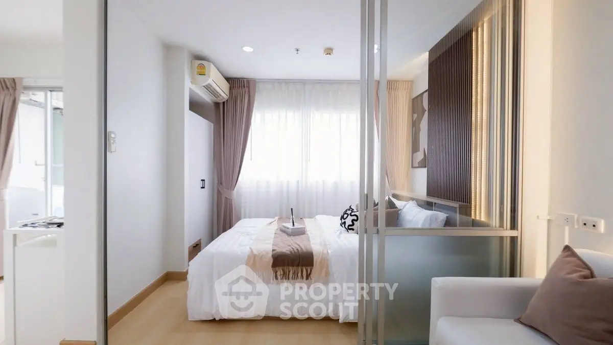 Modern bedroom with glass partition and natural light