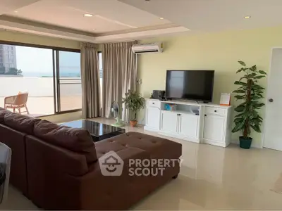 Spacious living room with large balcony and modern decor