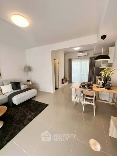 Modern open-plan living room with dining area and stylish decor