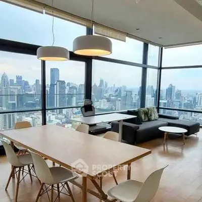 Stunning high-rise living room with panoramic city views and modern furnishings.