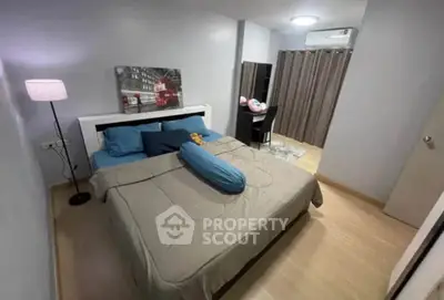 Cozy bedroom with modern decor and ample natural light