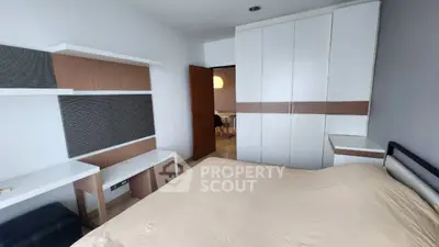 Spacious bedroom with modern built-in wardrobe and stylish decor